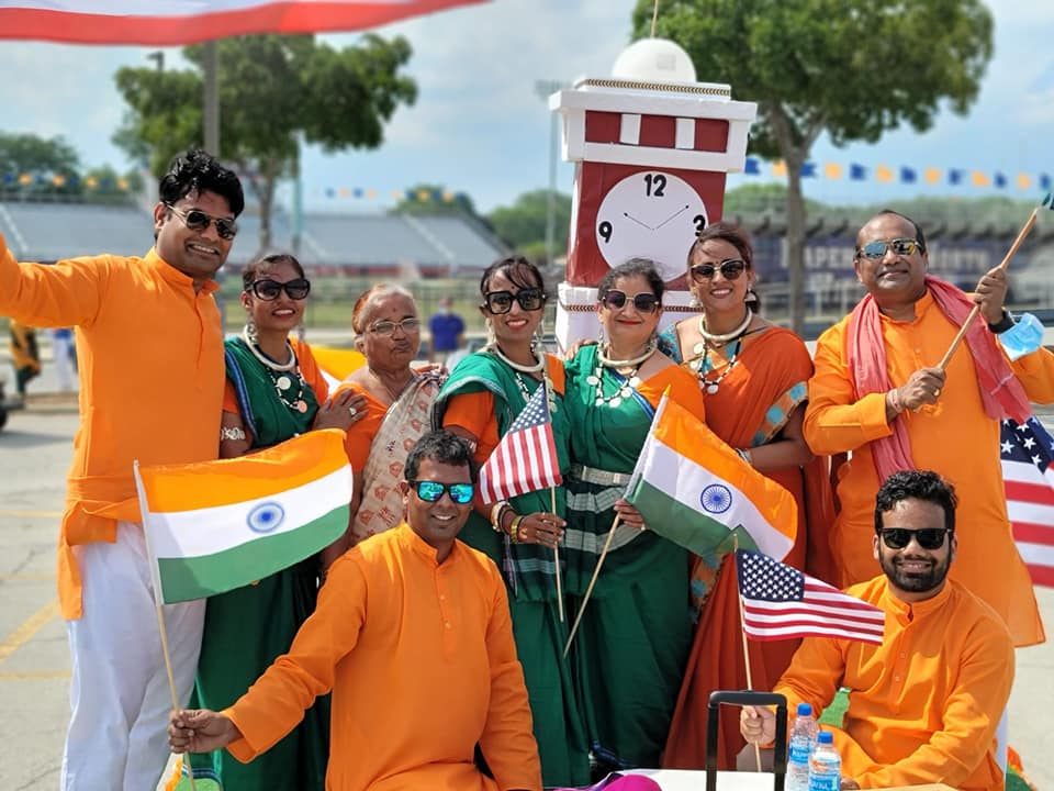 NACHA members holding Indian and US flags at an outdoor event